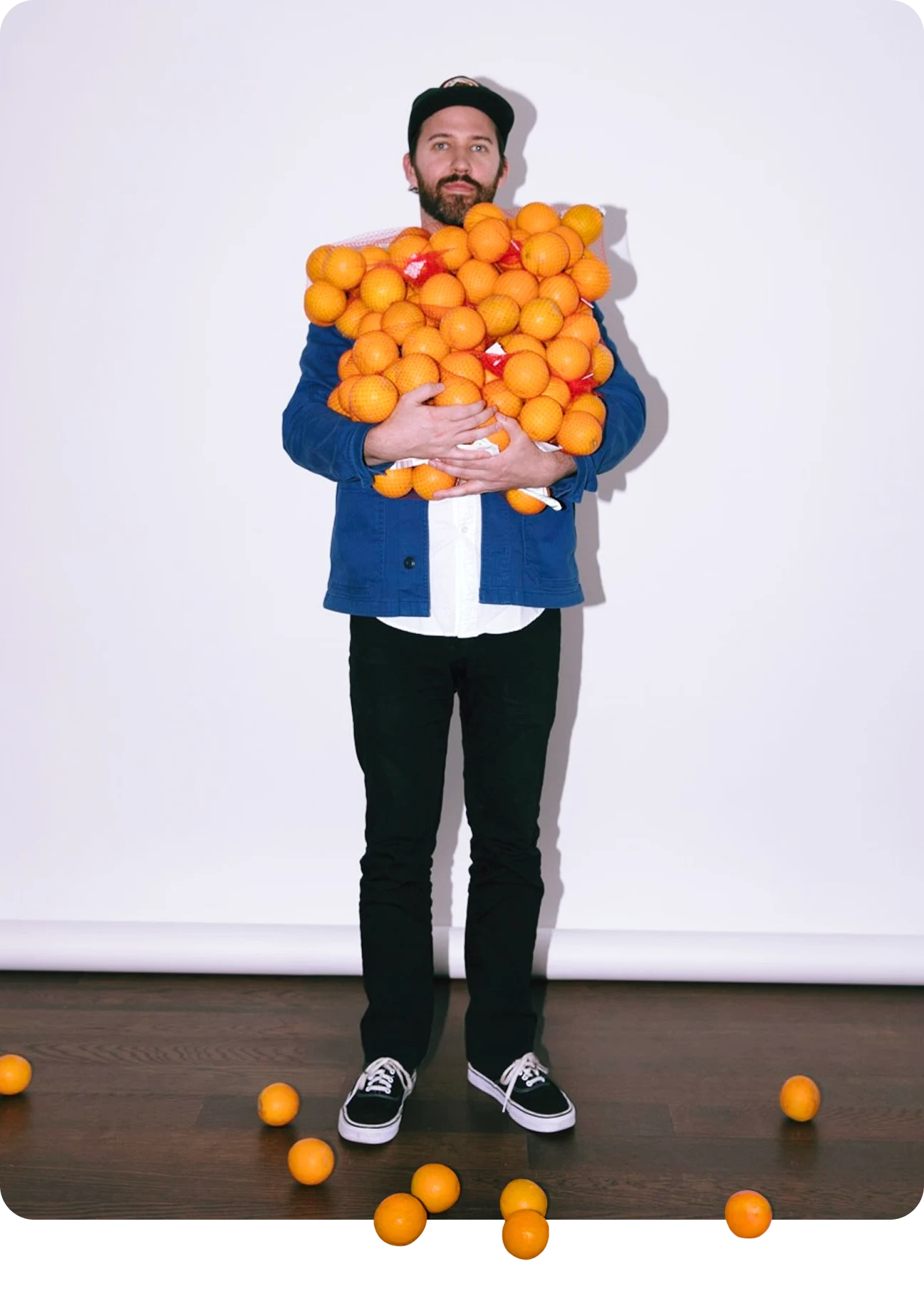 Derek Elijah Bradley holding oranges